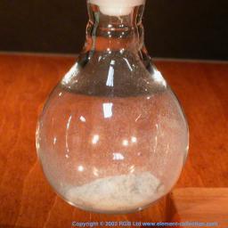 Flask containing thorium oxide